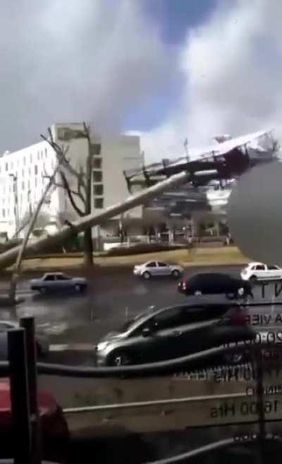 Old Advertisement Board Falls into Traffic in Mexico