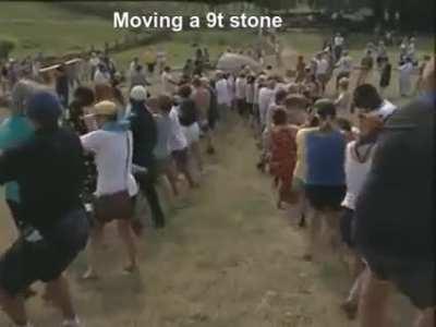 People pulling a 9t stone