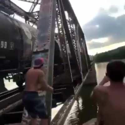 HMB while I climb onto a moving train and jump off a tall bridge into a river