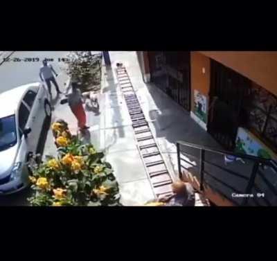 Man in wheelchair shakes a painters ladder because it was blocking the pavement 