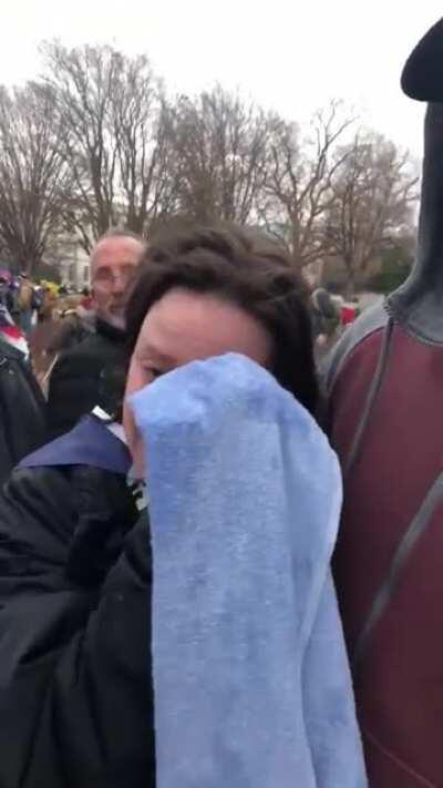 Woman who got maced storming the Capitol cries and says it was a revolution.