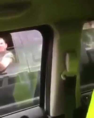 Giving the bird without looking at the road