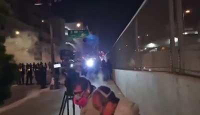 UniVision camera crew being shot at by LAPD as the line of officers encroaches on them