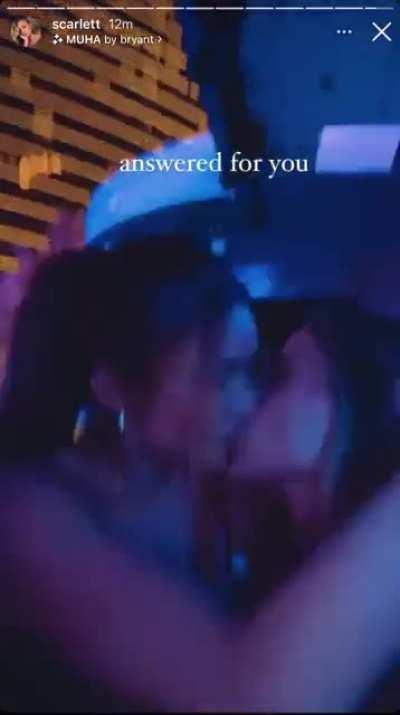 Giving Scarlett Leithold a kiss.