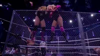 Lovely Laurie busted on the top rope in a steel cage match