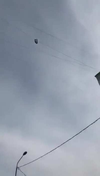 Drunk Guy tries crossing between 2 buildings on a wire