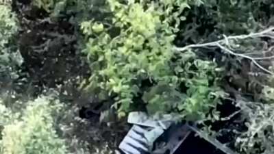 A drone captures a Russian soldier assaulting a Ukrainian dugout. His AK-12 jams, forcing him into hand-to-hand combat