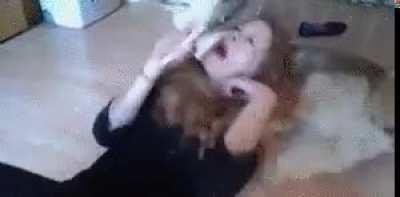 Girl cuddling with dog