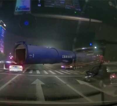 Petite white car gets plowed by BBC (big blue cylinder)