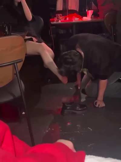 He sucks her toes in a bar