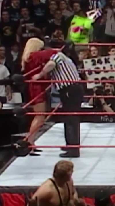 Debra pulls the ref's face into her busty bosoms!