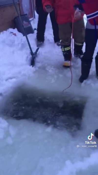 Canadian lost his phone in a frozen lake, so he goes looking for it