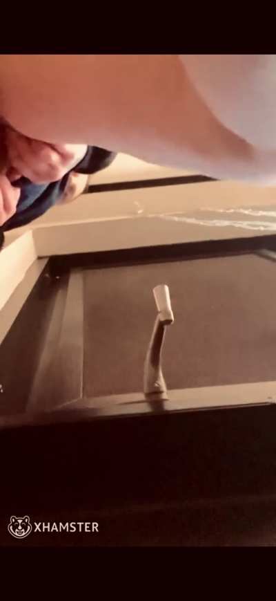 Pissing out a high window