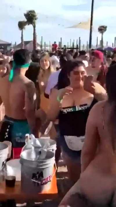 Riding black cock in front of a crowd