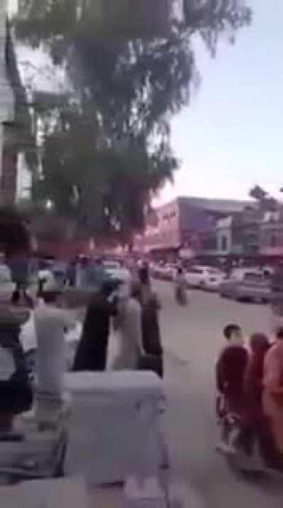 Teens and kids wtih flags taunt Taliban fighters on a humveea, warning shots fired by Taliban