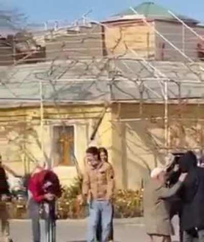 Old man tries to prevent the fight, without knowing the fight was going to be a scene for a film