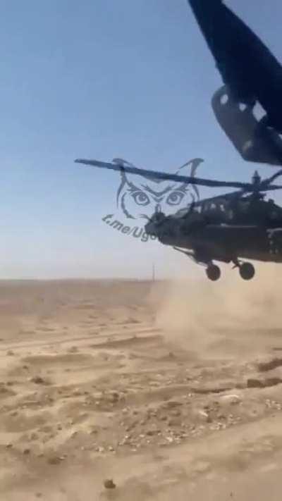 US Army Patrol accompanied by a Low flying AH-64 Apache somewhere in Syria