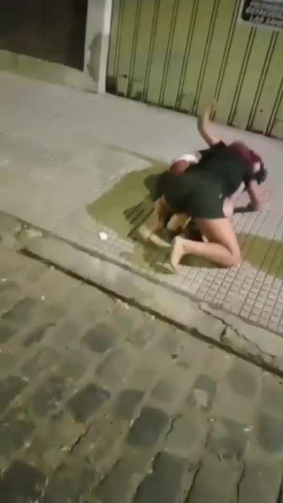 Latina girls fight on sidewalk