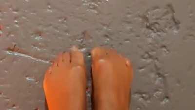 Glossy legs, shiny feet and glittery toes.