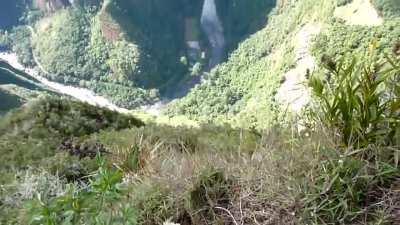 Climbing the 'Stairs of Death' at Huayna Picchu, Peru.