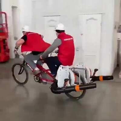 Using leaf blowers attached to a bike to get around a warehouse