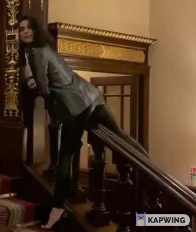 Riding the banister in leathers