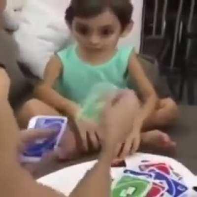 The guy behind the Uno wins