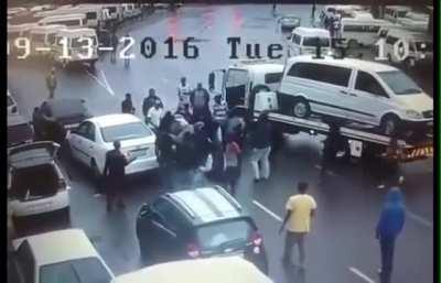 Two armed man try to hijack a car and everyone in the area try’s to help.