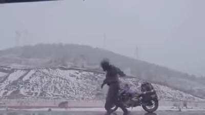 This cool guy dancing with the dog while on the snow. So Fun to watch!