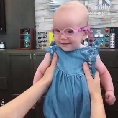 Baby girl sees Mom for the first time after wearing glasses
