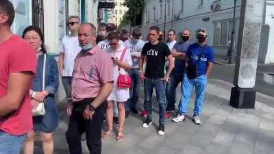 Hundreds waiting outside embassy of Belarus (Europe's last dictatorship). The white wristbands? Thats all the voters showing support for opposition candidate in today's election