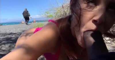 Naughty blowjob on public beach