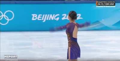 The sound from Sasha Trusova's microphone continues to be broadcast during Kaori's exit to the ice. She says 