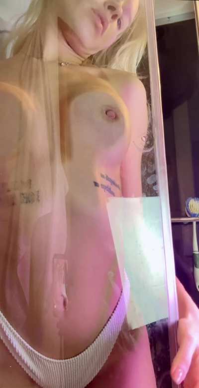 I'm totally turned on, my tits and clit are throbbing through the glass
