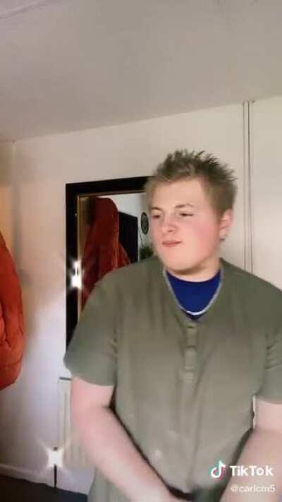 Guy Ferrari in his formative days, showing off his tits and bum fluff beard