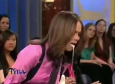 Tyra Banks pretending to have rabies