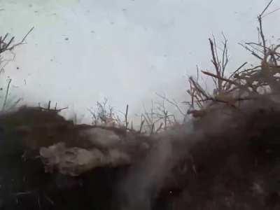 Ukrainian in a trench has a close call with an RPG warhead