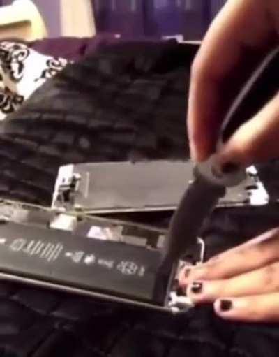 Kid tries cutting a battery