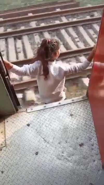 Girl jumps out of the moving train!