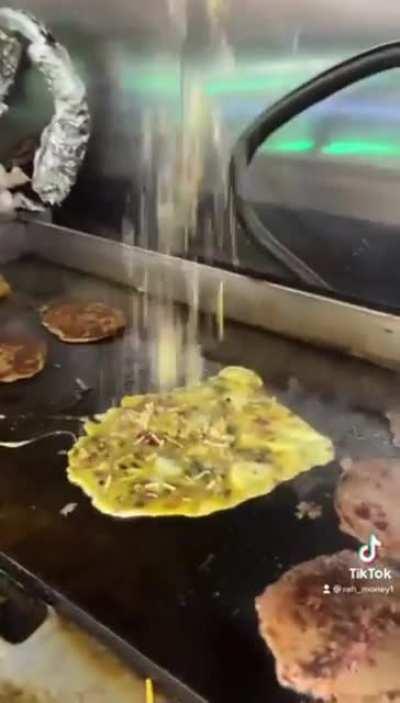 Blueberry pancakes (even though the dude asked for French toast?) on an omelette with mozzarella sticks and cheddar