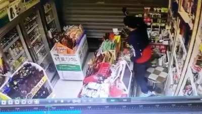 Thief trying to sneak under shutter down