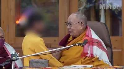 Dalai Lama asks little boy to 'suck my tongue'