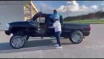 HMFT after dancing beside a lifted pickup truck