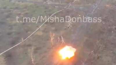 A Russian tank moving towards Ukrainian positions is hit and destroyed by an ATGM, filmed by a Russian drone.