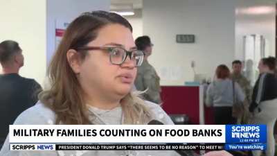 Military families line up around a food pantry during the government shutdown