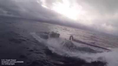 Drug-smuggling submarine being boarded by coast guard