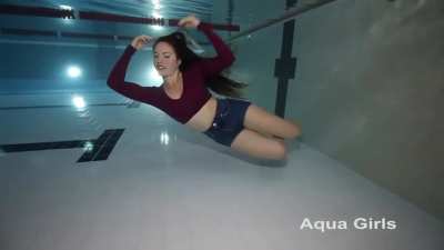 Cosima blows sexy bubbles fully clothed underwater.