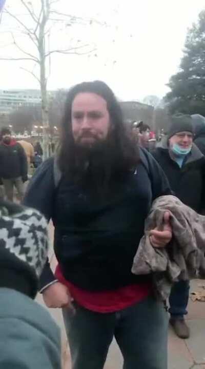 This Trump Terrorist was caught on camera beating a Capitol Police Officer unconscious with an American flag. Please contact the FBI if you know who he is.