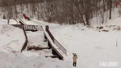 Snowboarding over some stairs with metal railings. How could that possibly go wrong?
