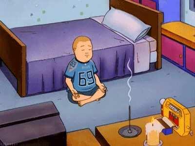 Bobby Hill meditating in his Neely attire.